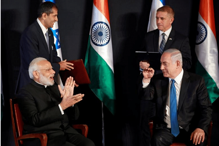 Indian Prime Minister Narendra Modi and Israeli Prime Minister Benjamin Netanyahu joke during an exchange of co-operation agreements ceremony in Jerusalem July 5, 2017. REUTERS/Amir Cohen