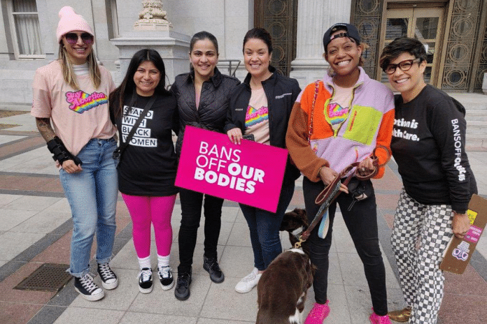 Senator Aisha Wahab (third from left) showing solidarity with other women at a rally in Oakland | Aisha Wahab/Twitter