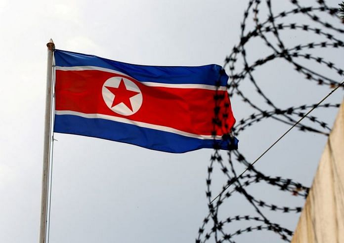 A North Korea flag flutters next to concertina wire at the North Korean embassy in Kuala Lumpur, Malaysia | Reuters