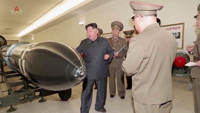 A screen grab shows North Korean leader Kim Jong Un inspecting nuclear warheads at an undisclosed location in this undated still image used in a video | Reuters