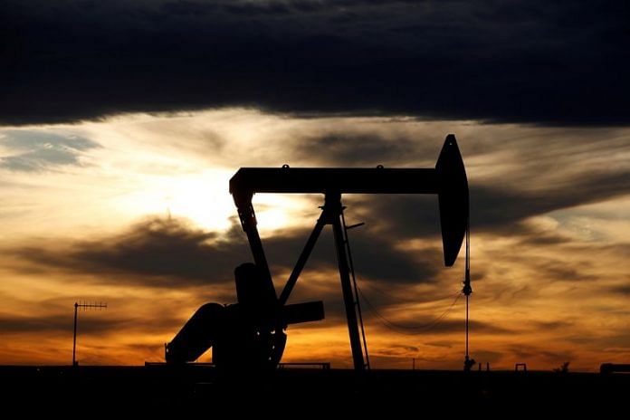The sun sets behind a crude oil pump jack on a drill pad in the Permian Basin in Loving County, Texas, US | Reuters file photo