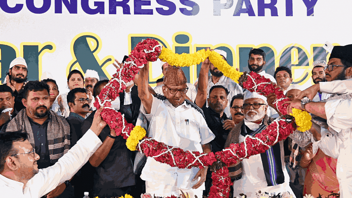 NCP chief Sharad Pawar being garlanded during an Iftar event in Mumbai last week | ANI