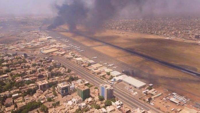 Black smoke rising above the airport in the Sudan's capital Khartoum | Twitter/@hitchhikenomad