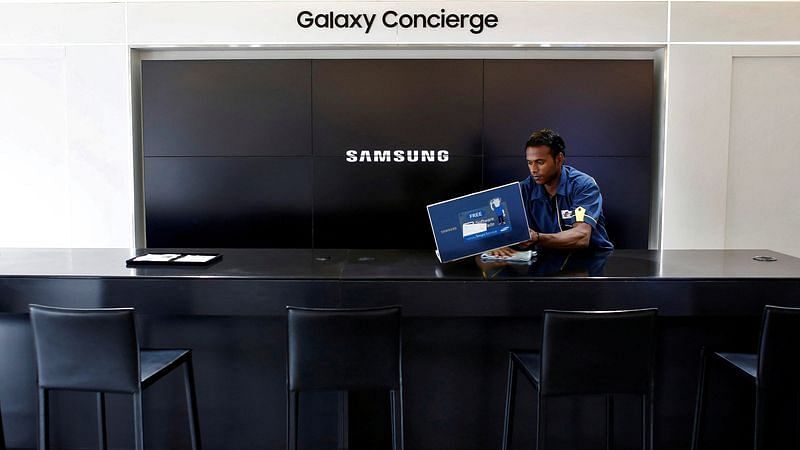A worker cleans a Samsung showroom in New Delhi | File Photo: Reuters