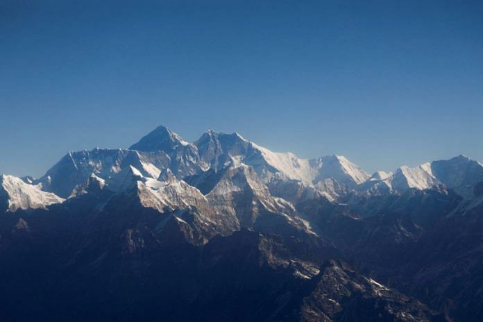 Mount Everest, the world highest peak, and other peaks of the Himalayan range are seen through an aircraft window | Reuters file photo