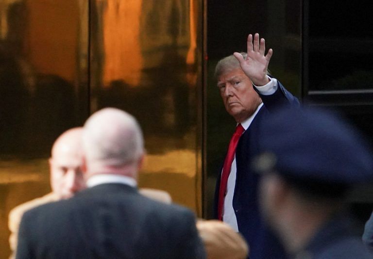 Trump arrives in New York for surrender in hush money case, opposes TV court coverage