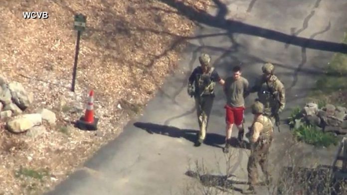 FBI agents arrest Jack Teixeira, an employee of the U.S. Air Force National Guard, in connection with an investigation into the leaks online of classified U.S. documents, outside a residence in this still image taken from video in North Dighton, Massachusetts on 13 April, 2023 | Reuters