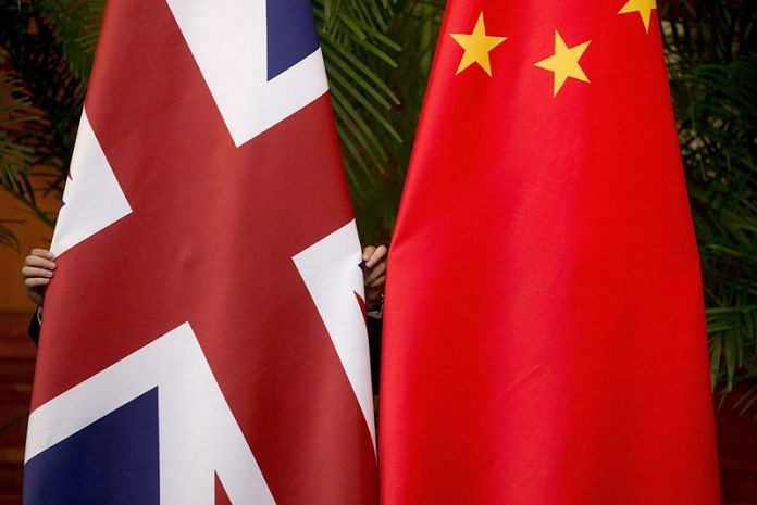 UK and Chinese national flags on display for a signing ceremony in Beijing | Reuters file photo
