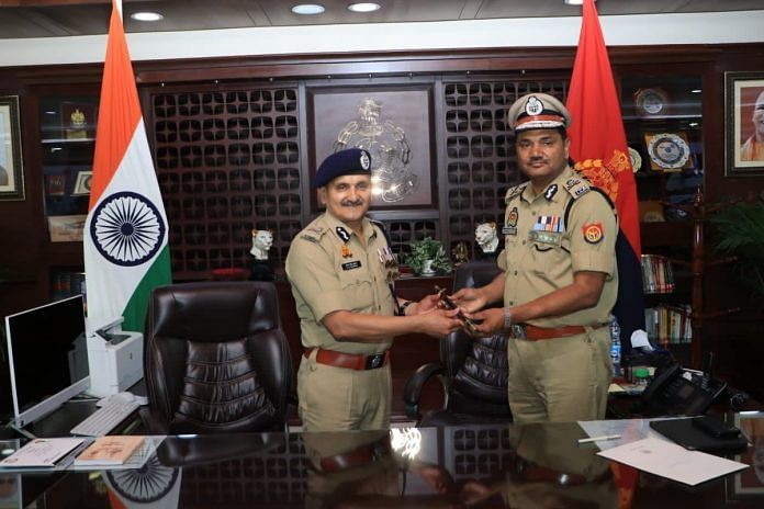 Devendra Singh Chauhan (left) handing over the charge of new acting DGP to DG (UP recruitment and promotion board) RK Vishwakarma | UP Police