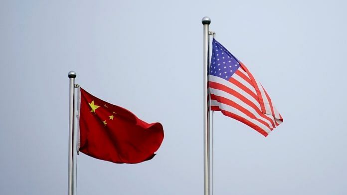 Chinese and US flags flutter outside a company building in Shanghai | Reuters file photo