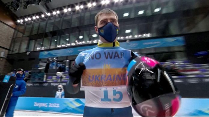 Vladyslav Heraskevych of Ukraine holds a sign with a message reading 'No war in Ukraine' | File Photo: Reuters