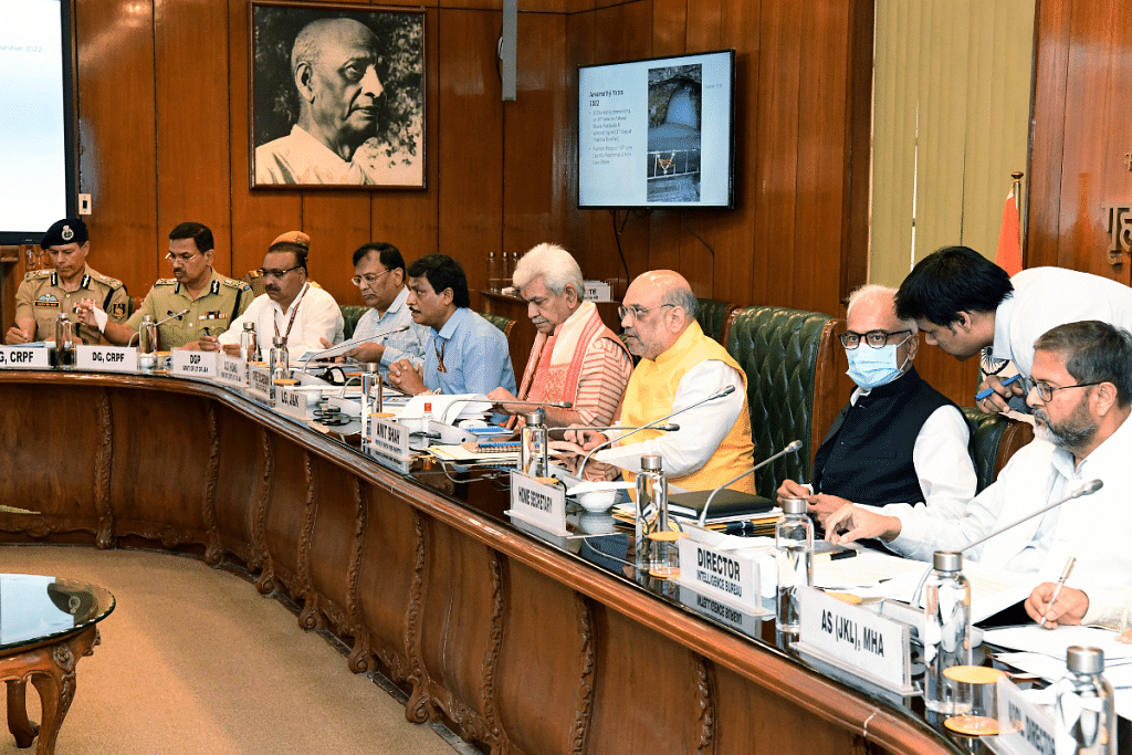 File photo of Union home minister Amit Shah & J&K L-G Manoj Sinha with senior IPS and IAS officers at a meeting | ANI