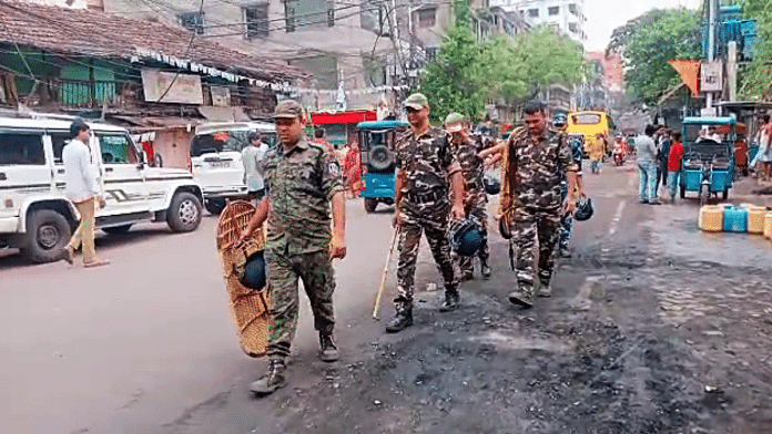 File photo of paramilitary personnel patrolling an area where arson occurred during ruckus while Ram Navami procession was underway in Howrah | ANI