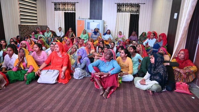 Neeru Yadav, sarpanch with women of Lambi Ahir, watching the short film on chura pratha | Special arrangement
