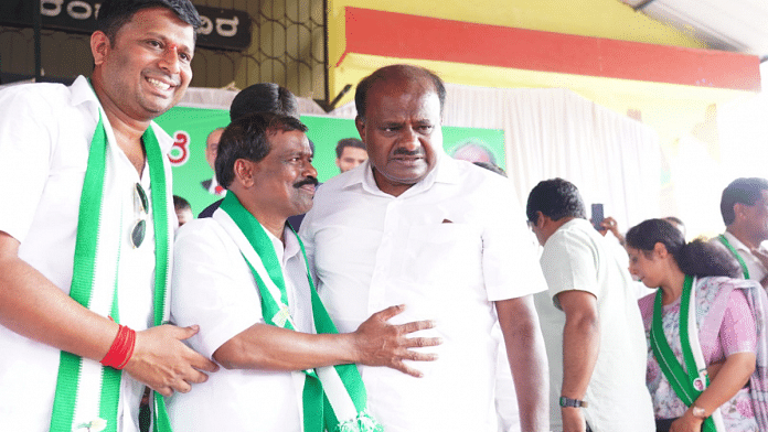 File photo of JD(S) leader and former Karnataka chief minister H.D.Kumaraswamy with party leaders at a meeting | Twitter | @hd_kumaraswamy