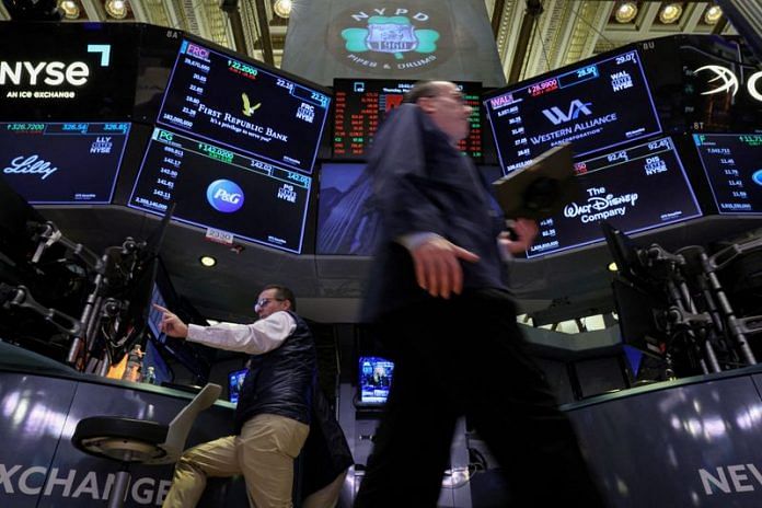 Traders work on the floor of the New York Stock Exchange (NYSE) in New York City | Reuters file photo
