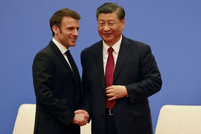 French President Emmanuel Macron and Chinese President Xi Jinping shake hands at a Franco-Chinese business council meeting in Beijing, on 6 April 2023 | Ludovic Marin/Pool via Reuters