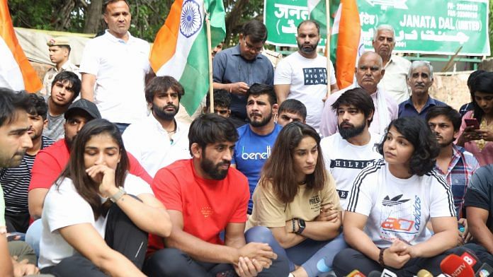 File photo of Bajrang Punia, Vinesh Phogat, and Sakshi Malik at wrestlers' protest at Jantar Mantar, New Delhi, Sunday | Manisha Mondal | ThePrint