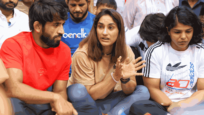 Bajrang Punia, Vinesh Phogat, and Sakshi Malik at wrestlers' protest at Jantar Mantar, New Delhi, Sunday | Manisha Mondal | ThePrint