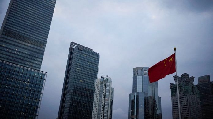 A Chinese national flag is pictured in Shanghai | Reuters
