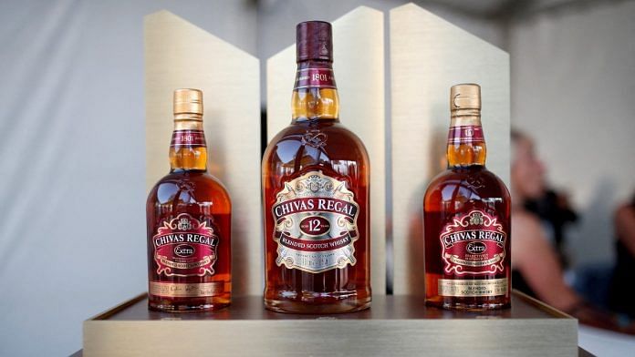 Bottles of Chivas Regal blended Scotch whisky, produced by Pernod Ricard SA, are displayed | Reuters