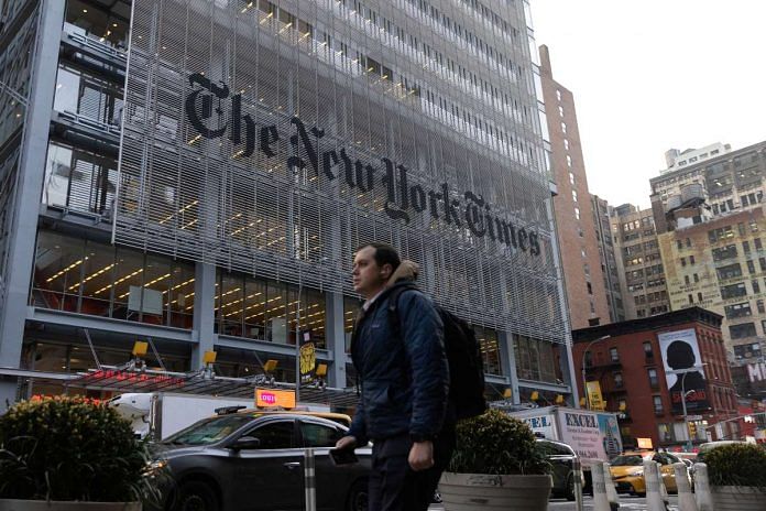 A pedestrian walks by the New York Times building in Manhattan, New York | Reuters file photo