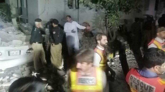 Police officers and rescue workers gather after explosions on the counter-terrorism office building in Swat, Pakistan, on 24 April 2023 | Rescue 1122/Handout via Reuters