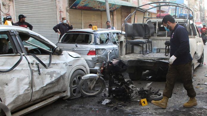 A member of a crime scene unit surveys after a blast in Quetta, Pakistan, on 10 April 2023 | Reuters