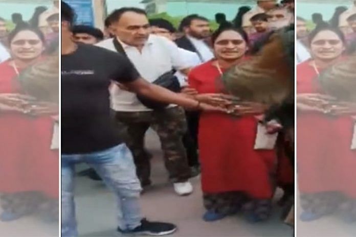 Screengrab from a video of the woman outside Saket court after she was shot at | ANI