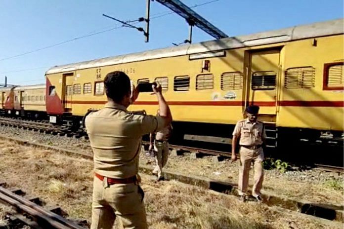 Police personnel during an investigation into the train fire incident in Kerala | Photo: ANI Photo