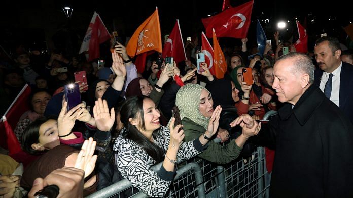 Turkish President Tayyip Erdogan greets his supporters as he leaves his residence in Istanbul, Turkey on 14 May, 2023 | Reuters