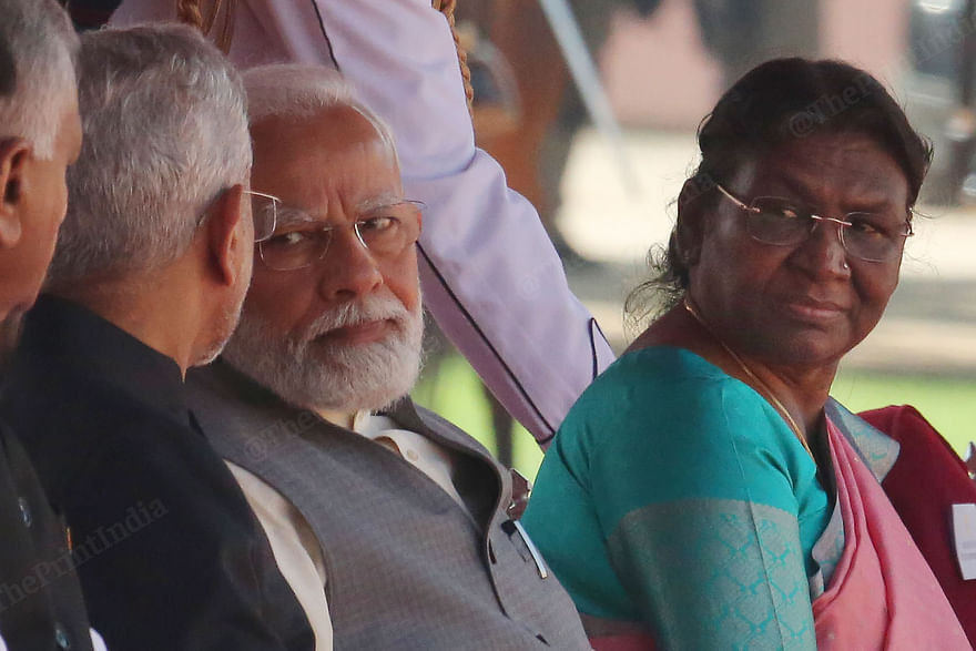 President Murmu looks at PM Modi as he talks to external affairs minister S, Jaishankar | Photo: Praveen Jain | ThePrint