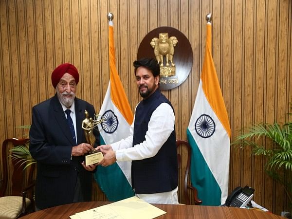 Sports Minister Anurag Thakur felicitates Sarpal Singh for his contribution to field hockey