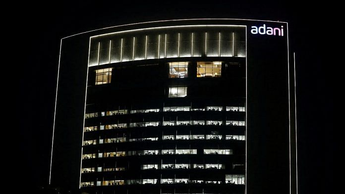 The logo of the Adani Group is seen on the facade of its Corporate House on the outskirts of Ahmedabad | Reuters