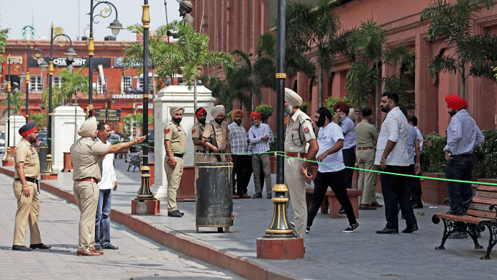 Police personnel and forensic officials at the site where the low-intensity blast occurred at Heritage Street near the Golden Temple in Amritsar on Monday | ANI