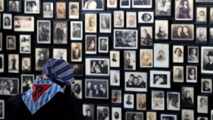A Holocaust survivor takes part in the 78th anniversary of liberation of Nazi German Auschwitz-Birkenau death camp in Oswiecim, Poland | Jakub Porzycki/Agencja Wyborcza.pl via Reuters
