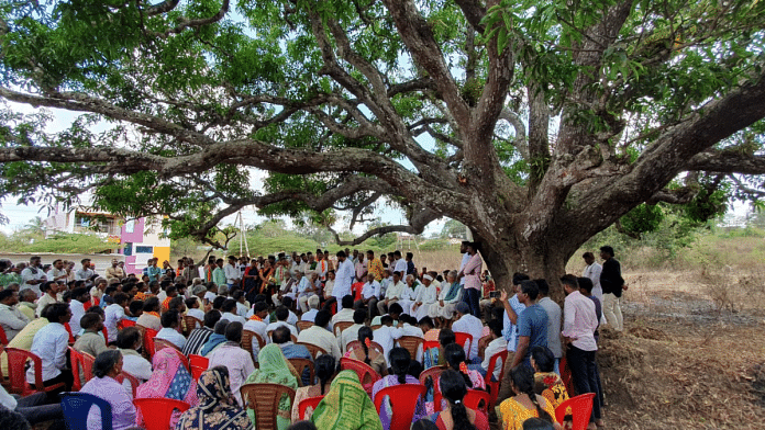 Vinay Kulkarni, the Congress candidate from Dharwad Rural, addresses his supporters in the shade of a mango tree at Giriyal village in Kittur of Belagavi district | Sharan Poovanna | ThePrint
