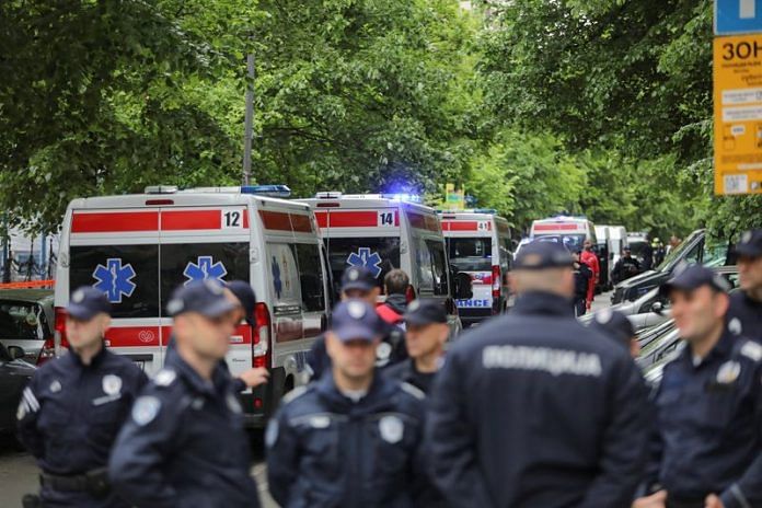 Police officers stand outside the school where a shooting took place in downtown Belgrade, Serbia on 3 May 2023 | Photo: REUTERS/Djordje Kojadinovic