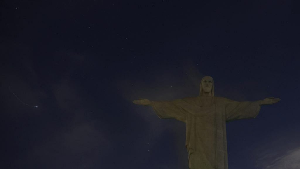 The Christ the Redeemer has its lights turned off to condemn "racist attacks" on Brazilian soccer star Vinicius Jr in Spain, in Rio de Janeiro, Brazil, on 22 May 2023 | Reuters/Pilar Olivares