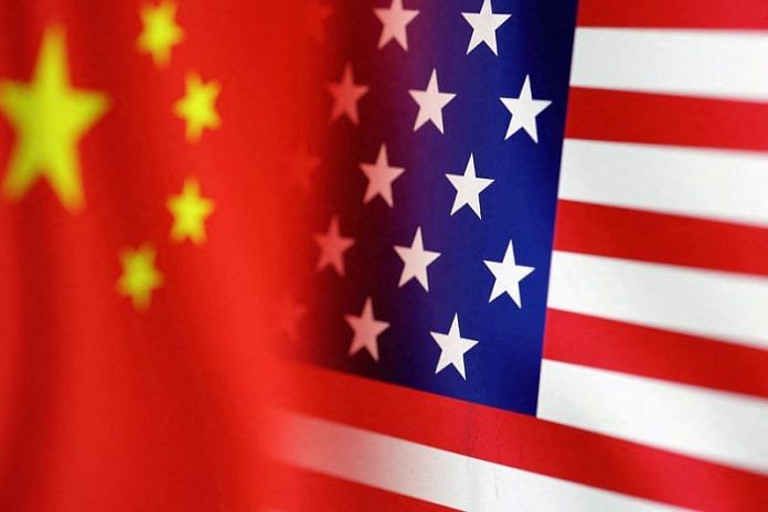 US and Chinese flags | Illustration by Dado Ruvic/Reuters