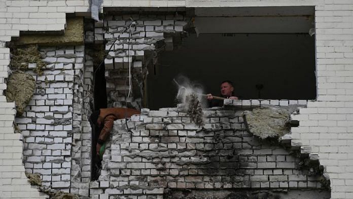 local resident cleans from debris his apartment which was damaged by remains of a Russian missile, amid Russia's attack on Ukraine, Kyiv | File Photo: Reuters