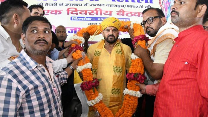 Brij Bhushan Singh being garlanded at an event promoting the Jan Chetna Maharally in Bahraich | Twitter @b_bhushansharan