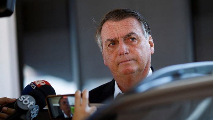 Former Brazilian President Jair Bolsonaro leaves his home following a search operation in Brasilia, on 3 May 2023 | Reuters