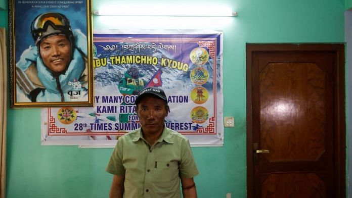 Kami Rita Sherpa, 53, a Nepali Mountaineer who climbed Mount Everest for a record 28 times, poses for a picture at his rented apartment in Kathmandu on 28 May, 2023 | Reuters