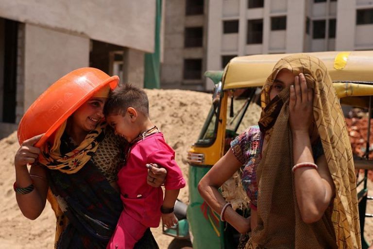 Poor workers in Gujarat enroll in one of world’s first insurance schemes for extreme heat
