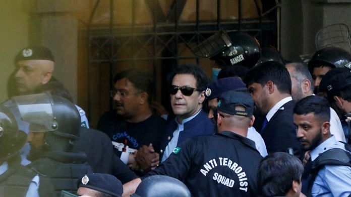 Pakistan's ex-PM Imran Khan surrounded by security personnel at Islamabad HC on 12 May, 2023 | Reuters/Akhtar Soomro