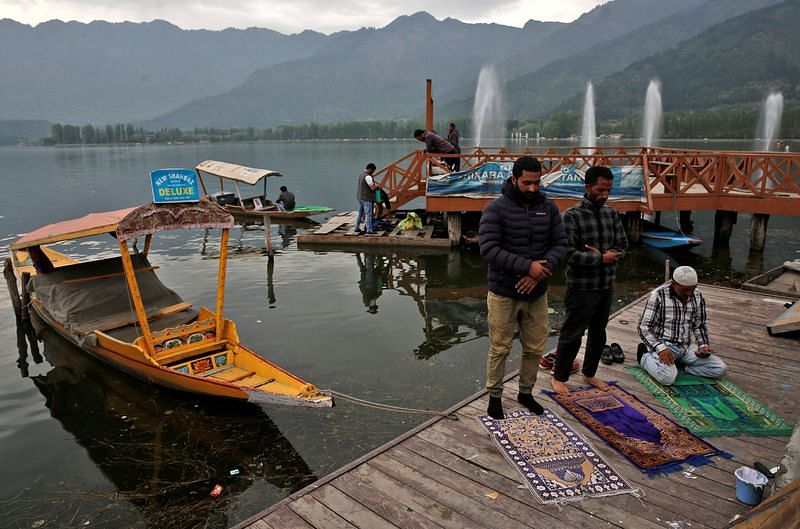 Muslim men offer prayers on the banks of Dal Lake, during the fasting month of Ramadan, in Srinagar | Reuters file photo