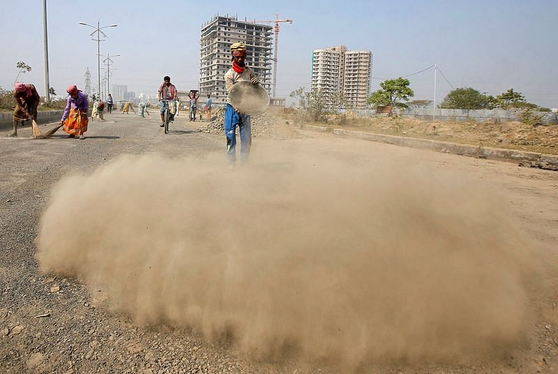 Labourers build a road near the construction site of a residential complex on the outskirts of Kolkata | Reuters file photo