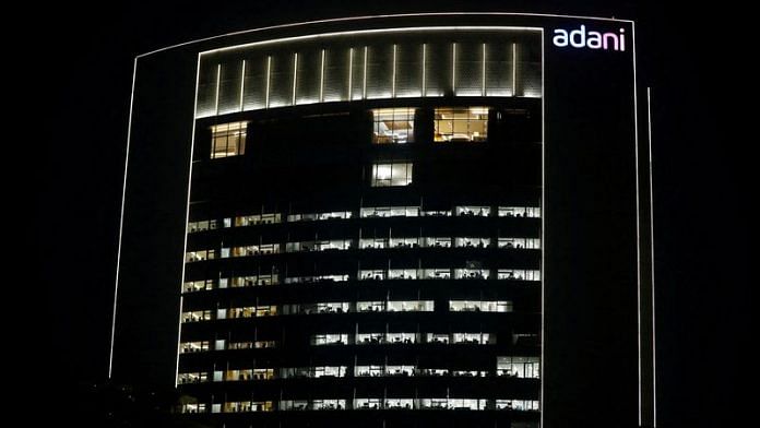 The logo of the Adani Group is seen on the facade of its Corporate House on the outskirts of Ahmedabad | File Photo: Reuters