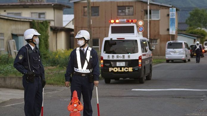 Police officers stand near the scene of a stabbing and shooting incident in Nakano, Nagano Prefecture, Japan, on 25 May 2023 | Mandatory credit Kyodo via Reuters
